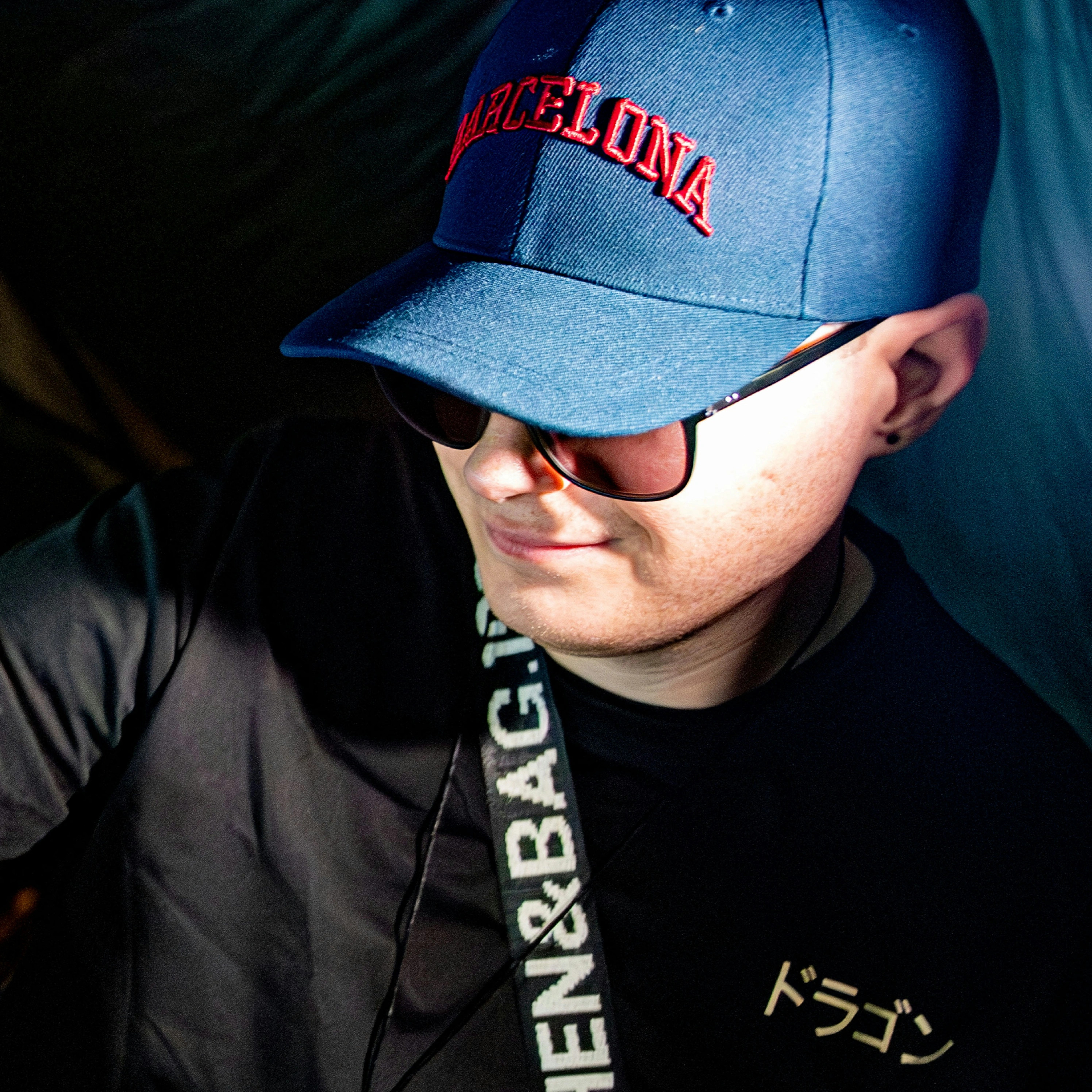 Ember Audio promo portrait wearing a Barcelona cap